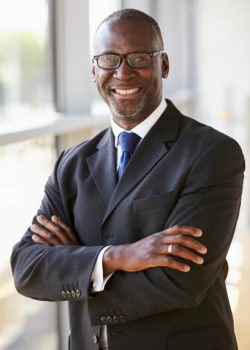 Portrait of a smiling businessman with arms crossed